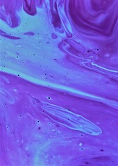 Abstract blue-lilac marble background. Acrylic paint flows freely and creates an interesting...