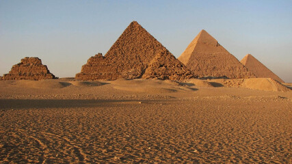Fototapeta na wymiar Panorama all 6 pyramids at sunset Cairo Egypt deserted in the desert