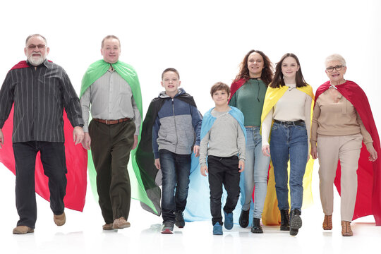 in full growth. happy family in superhero raincoats.