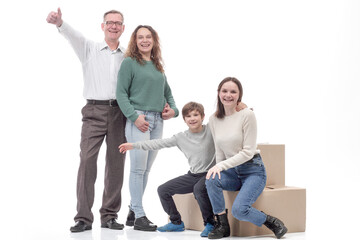 Fototapeta premium in full growth. happy family with cardboard boxes.