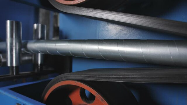 Power armored cable on a production belt with specialized equipment. Production of power cable.