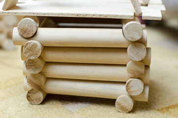 Wooden house and logs built from a children's construction set