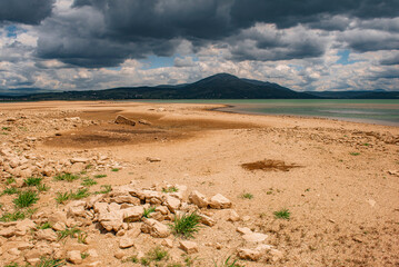 landscape with lake and storm clouds