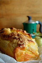 Yeast dough with apples on white baking paper