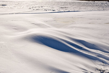 Textured snow patterns on the ground