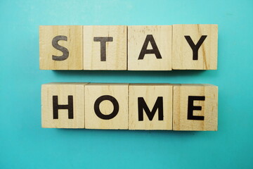 Stay Home alphabet letter on blue background