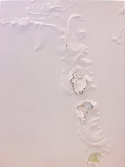bubbling and peeling paint on a wall due to humidity  problem