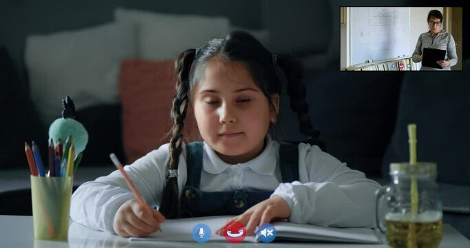 Cute schoolgirl girl child student who raises her hands at a distance, learning online, talking to the camera in class virtual lessons. Woman teacher teaches classes online, screen - Powered by Adobe
