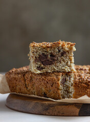 Oatmeal squares with chocolate, light concrete background. Diet bars. Healthy bakery for breakfast or dessert.