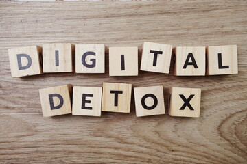 Digital Detox alphabet letter on wooden background