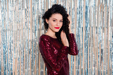 Profile portrait of gorgeous flirty lady hands touch curly hairstyle look camera isolated on shiny curtain background