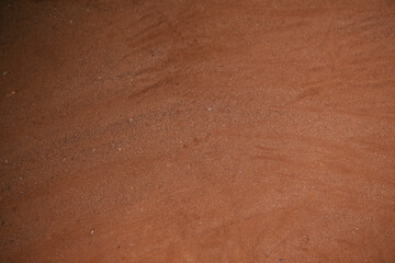 Ground texture background of red desert soil, dusty land, dry earth and sand