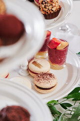 sweet catering. macarons and delicious desserts on the festive table. close-up