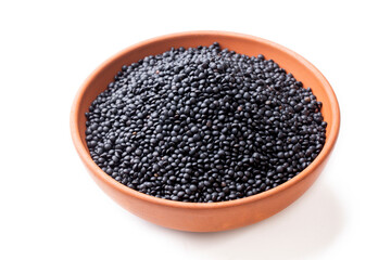 Portion of Black Lentils (detailed close-up shot) isolated on white background