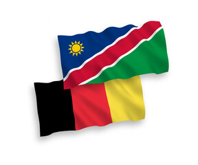 National vector fabric wave flags of Republic of Namibia and Belgium isolated on white background. 1 to 2 proportion.