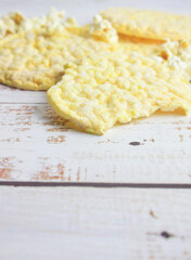 Corn pancakes, in a circular shape.
Space for text or idea.