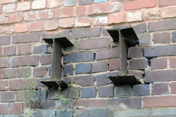 Rusty Industrial Steel Beams in Old Brick Wall 