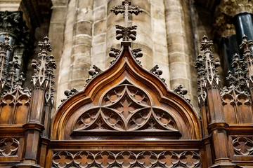Foto op Aluminium Gothic architecture. Cross on a wooden base with patterns. Prayer booth. © Nadtochiy