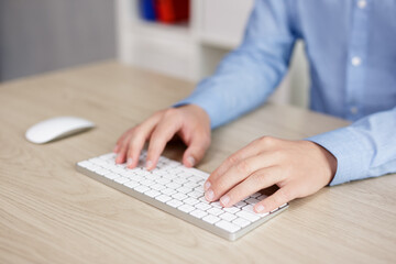businessman using computer - close up of male hands on keyboard