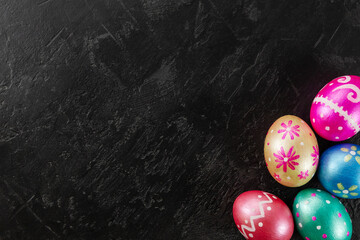Easter eggs trendy colored classic deep blue, green, orange, magenta and golden decorated on black...
