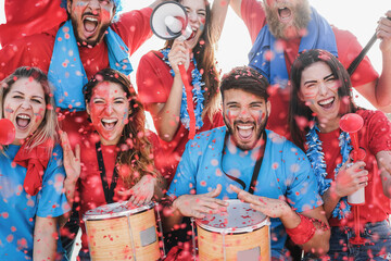 Crazy football supporters playing drums and screaming while supporting their team for 2021 european...