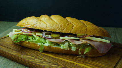 Big sandwich on dark background. sandwich with fresh vegetables