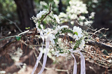 White bridal accessories of a wedding at nature