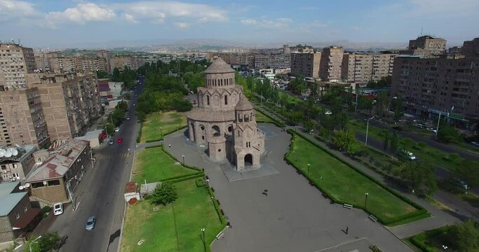 	Armenian Apostolic Church Surp Yerrortutyun (Holy Trinity) in Malatia-Sebastia District of Yerevan, Armenia, capital of Armenia. Aerial view 
newly built church in city.