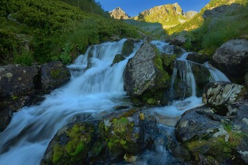 Naklejka na ściany i meble Waterfall in mountains