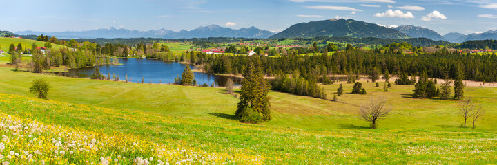 Fototapeta na wymiar panoramic landscape with mountain range in Bavaria at springtime