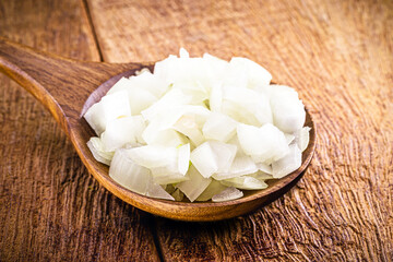 large Brazilian onions in rustic copper pot, shelled vegetables, seasoning or culinary ingredient