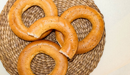 Bagels with poppy seeds on the table.