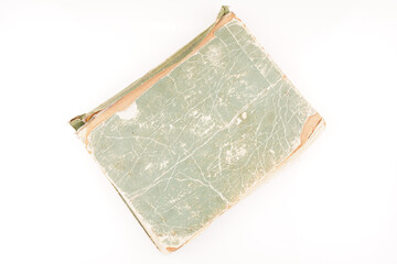 old green book on white background