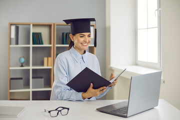 Getting degree online. Happy student graduating from business school, college or university. Smiling woman sitting at laptop computer and presenting course work, thesis or dissertation via video call