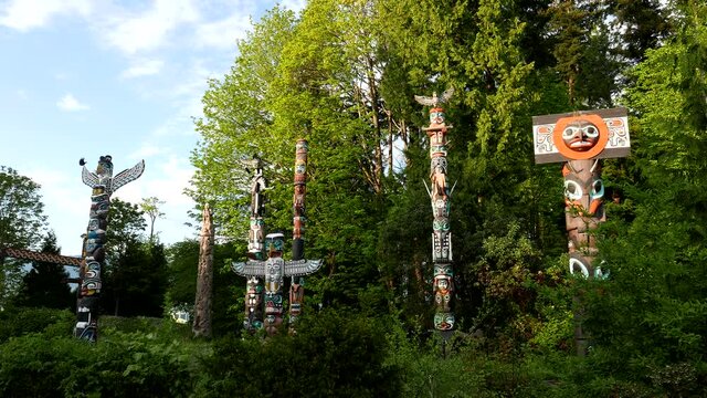 Native totem poles inside downtown Stanley Park with 4k resolution
