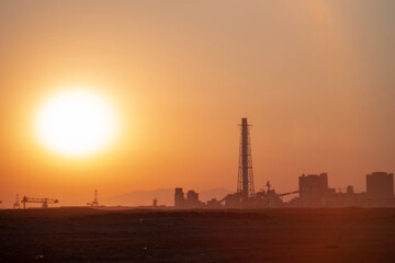 Fototapeta na wymiar oil refinery at sunset