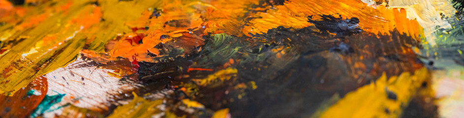 colored oil paintings brush strokes on a relaxed home artist's palette
