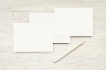Two blank horizontal white cards mockup and envelope, top view, minimal style.