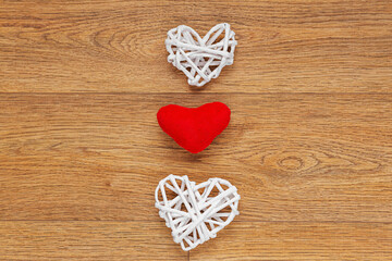 white paper  hearts  on wooden background