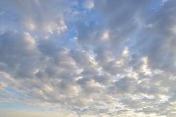 Stratocumulus clouds with a blue tint.