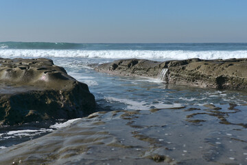 Closeup of rock formations at La Jolla Tide Pools, San Diego in the afternoon on a sunny day in December; facing the Pacific ocean.