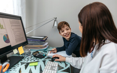 Woman teleworking at home talking with her son