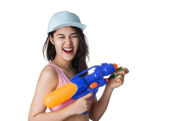Young Asian woman holding plastic water gun at Songkran day, Thailand festival.