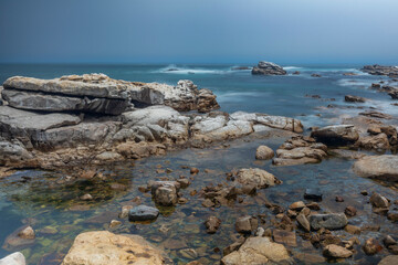 Fototapeta na wymiar A scenic view of rocks and the ocean with motion blur at Lambert's Bay, Western Cape, South Africa