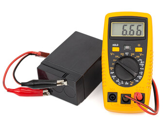 Testing an acid rechargeable battery with a measuring instrument isolated on white background