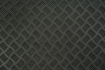 Closeup top view flatlay stock photography of texture of black protective hdpe rug or mat for boot...
