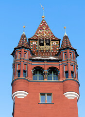 Fototapeta na wymiar The tower of the Basel Town Hall, the seat of the Basel government and its parliament. One of the most beautiful buildings in Europe.