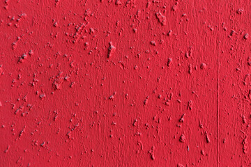 Red painted textured concrete cement wall background