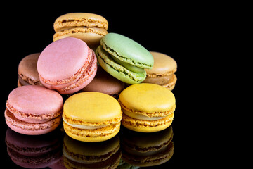 macarons on a black background. Typical french sweet