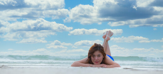 Happy lifestyle asian woman in sea beach, relax on the beach in summer. Travel Concept